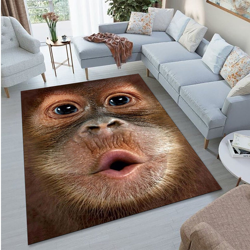 Monkey See Monkey Rug featuring realistic 3D orangutan face design on area rug in modern living room with gray sofa