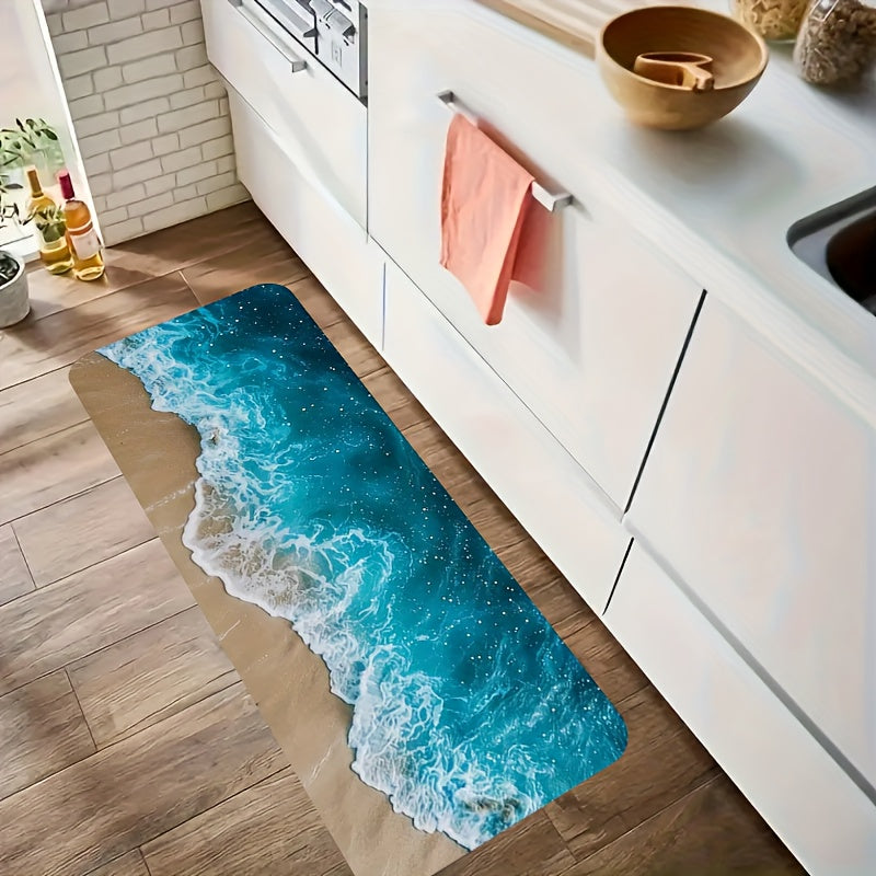 Ocean Bliss anti-fatigue kitchen mat featuring turquoise waves and sandy beach design on wooden floor against white cabinets