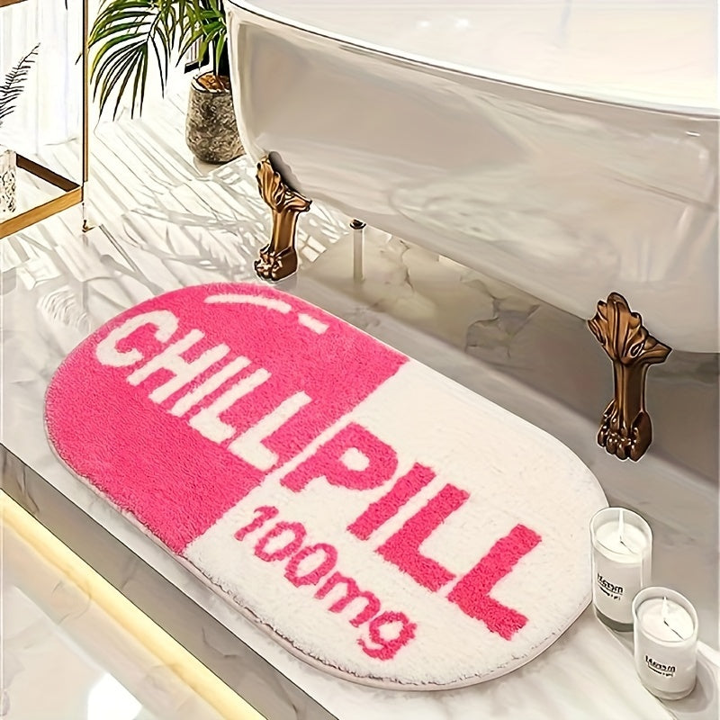 Pink and white ChillPill bathroom rug shaped like a capsule pill next to vintage clawfoot tub in elegant bathroom setting