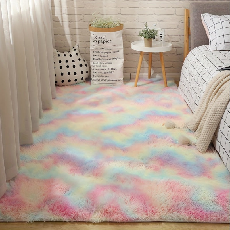 Plush CloudCotton rug in pastel rainbow gradient colors styled in cozy bedroom with white decor and plants