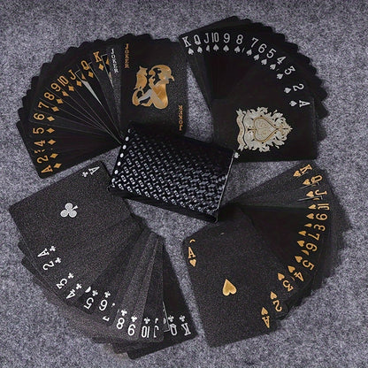 PrestigeDeck luxury playing cards fanned out in black and gold design with ornate face cards and textured back pattern
