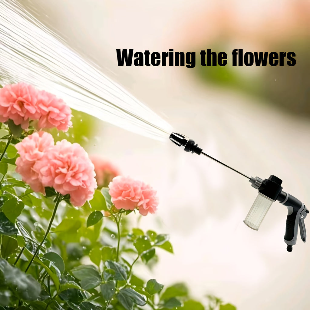 ProClean High-Pressure Car Wash Gun spraying water stream at pink flowers, demonstrating adjustable spray pattern and soap dispenser