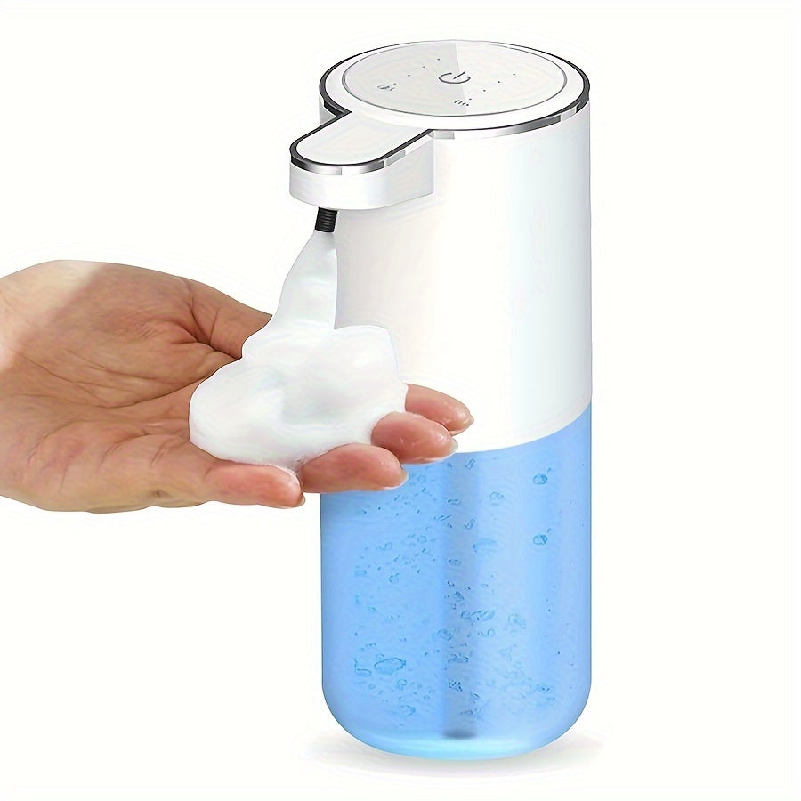 PureTouch automatic soap dispenser dispensing foam soap onto hand, white device with transparent blue base showing liquid soap