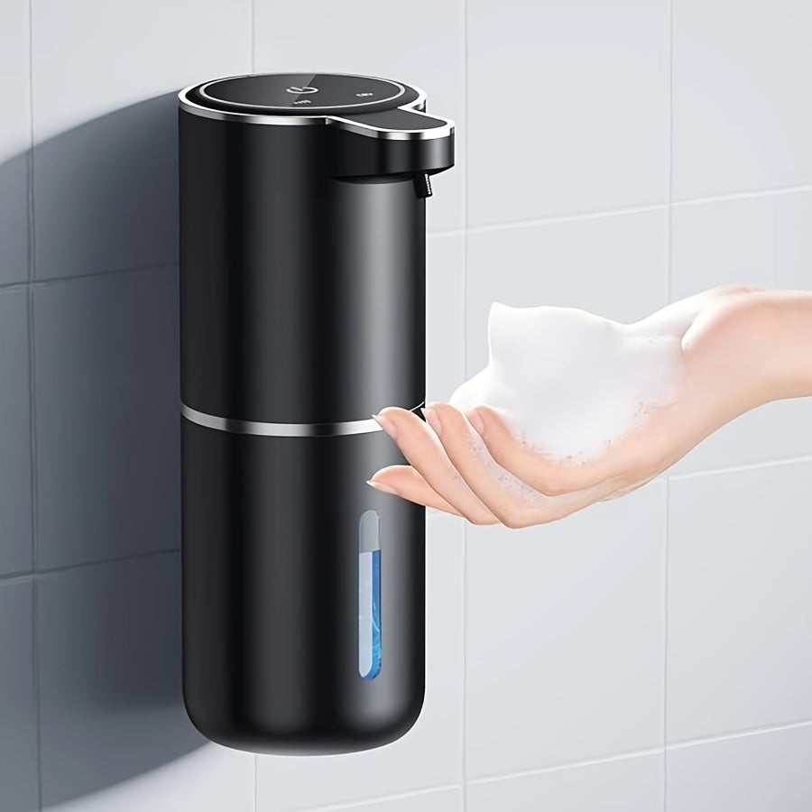 PureTouch automatic soap dispenser in matte black mounted on bathroom wall, dispensing foam soap into open palm