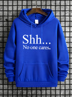 Royal blue Shh No One Cares hoodie with white text print and kangaroo pocket displayed on wooden hanger
