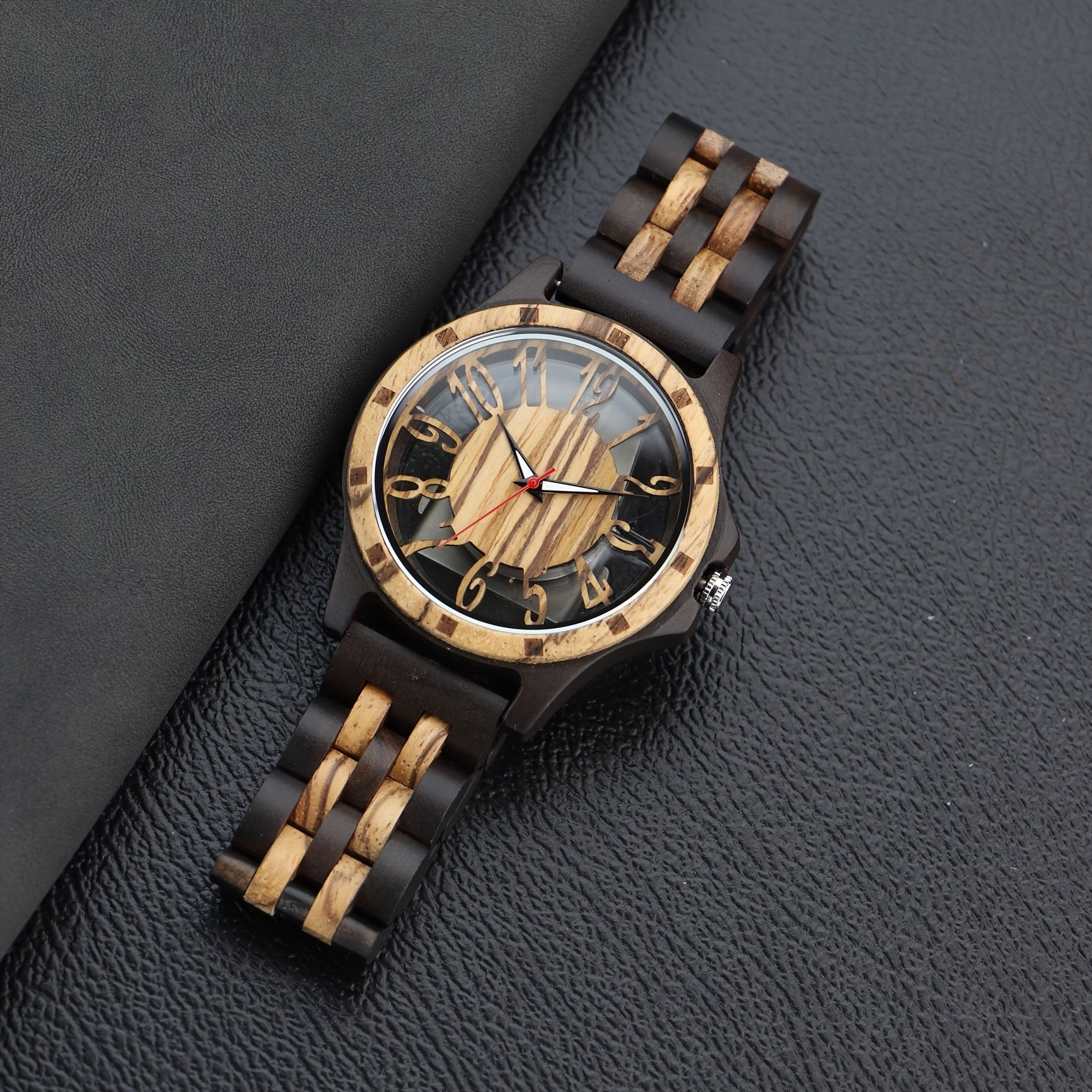RusticEdge wooden timepiece with black and natural wood band, hollow carved dial on dark leather surface