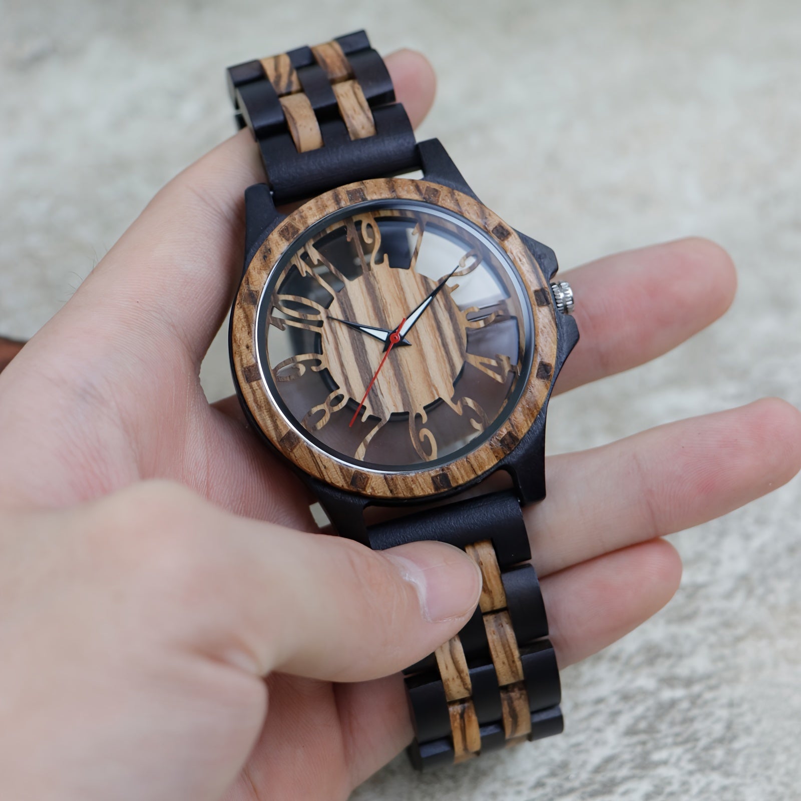 RusticEdge wooden watch with black and natural wood band, hollow dial design showcasing intricate carved face and numerals