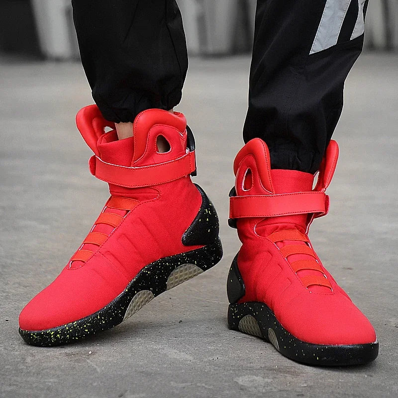 HighPeak NeoVolt Sneakers in bright red with black speckled soles worn with black pants on concrete background