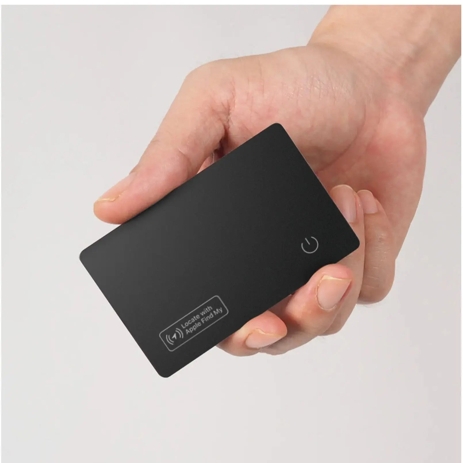 HighPeak Smart Tracker Card in black held in hand showing slim design and Apple Find My compatibility icon.