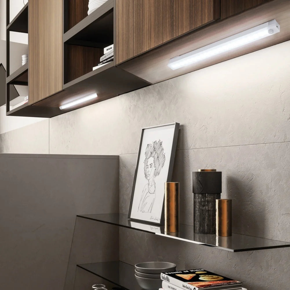 HighPeak Motion Sensor Light installed under kitchen cabinets glowing bright white for hands-free ambient lighting.