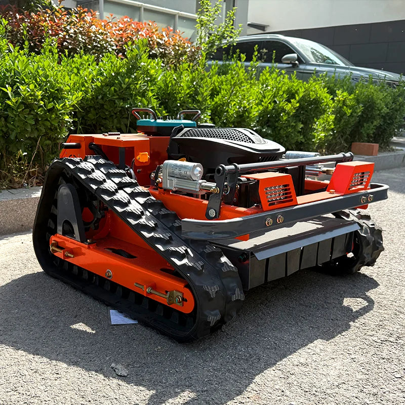 HighPeak Self-Driving Lawn Mower in orange with tracked crawler wheels on pavement, designed for rugged terrain mowing.