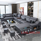 Modern Tech Sofa by HighPeak in gray with Bluetooth speakers, USB charging, modular chaise, and sleek storage in a modern living room setting