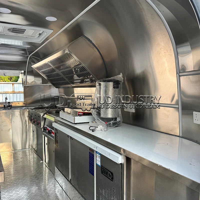 HighPeak Airstream Food Trailer interior with stainless steel kitchen, commercial appliances, and custom layout ready for food service.