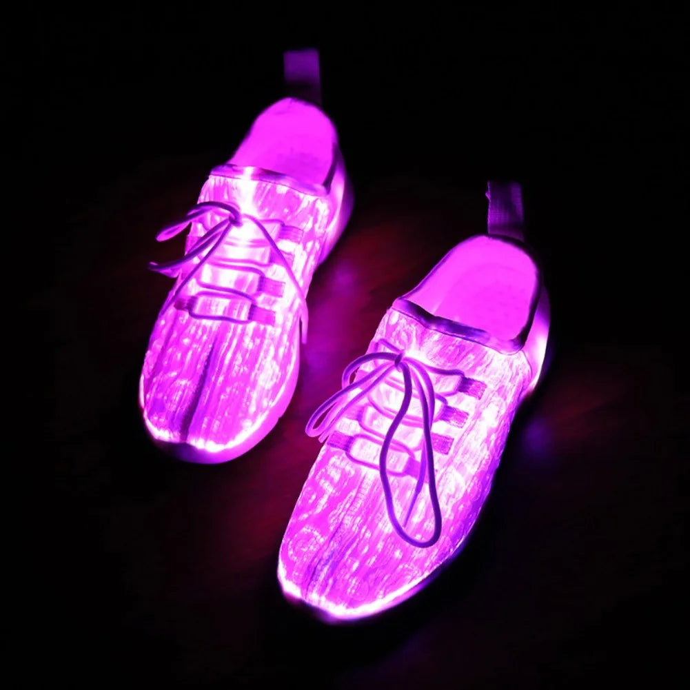 Glowstride Sneakers glowing bright pink with fiber optic lighting and laces in a dark setting by HighPeak