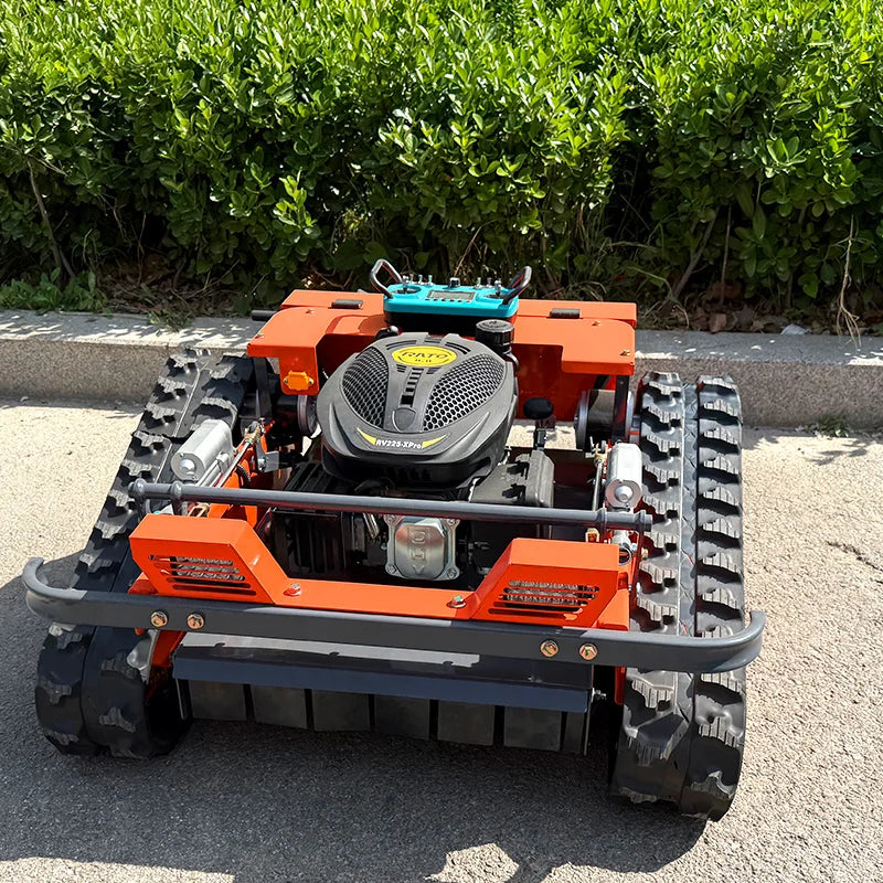 HighPeak Self-Driving Lawn Mower in orange with tracked crawler wheels on pavement near greenery for rugged terrain mowing.