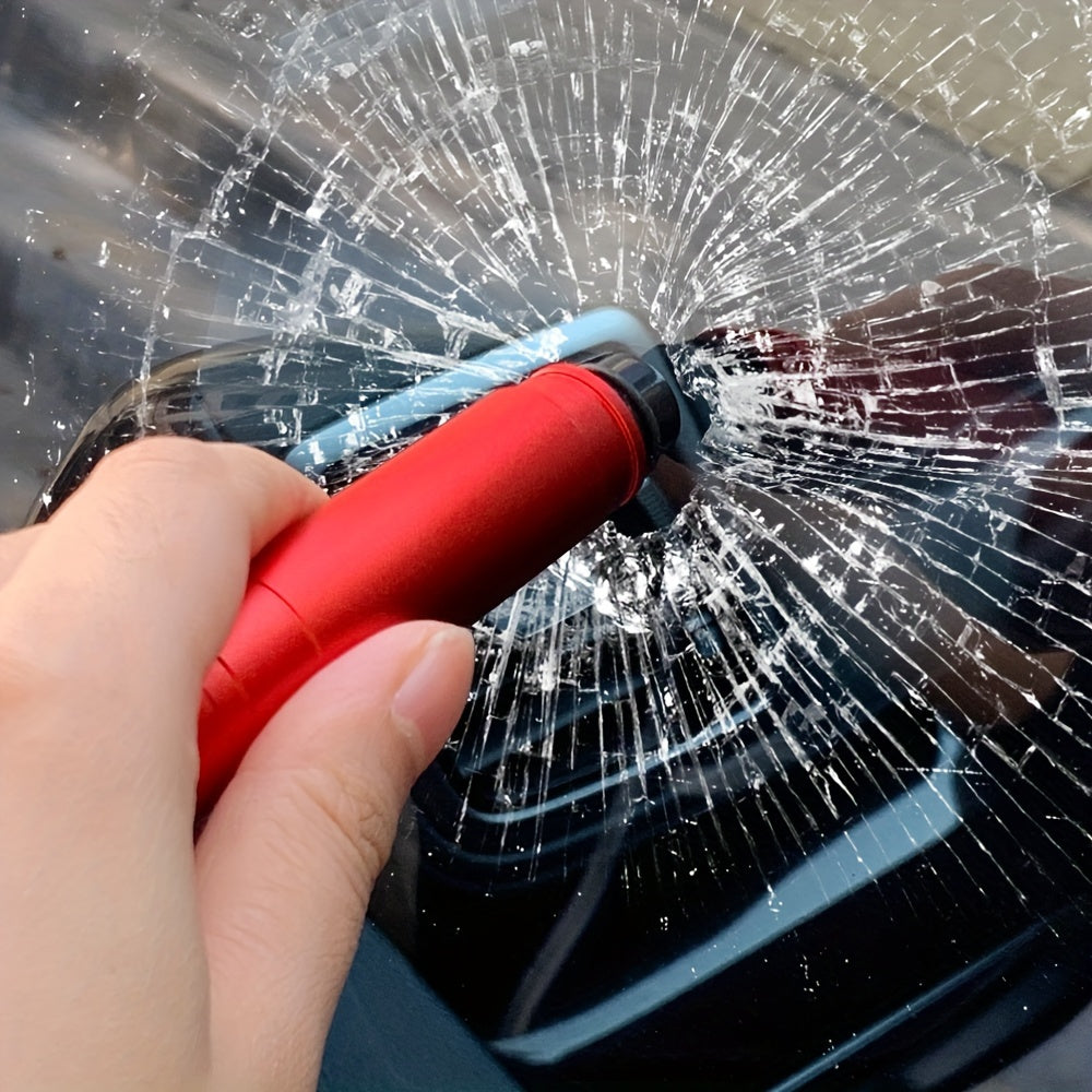 SafeStrike emergency car escape tool in red aluminum breaking car glass with spring-loaded tungsten tip demonstrating instant shatter
