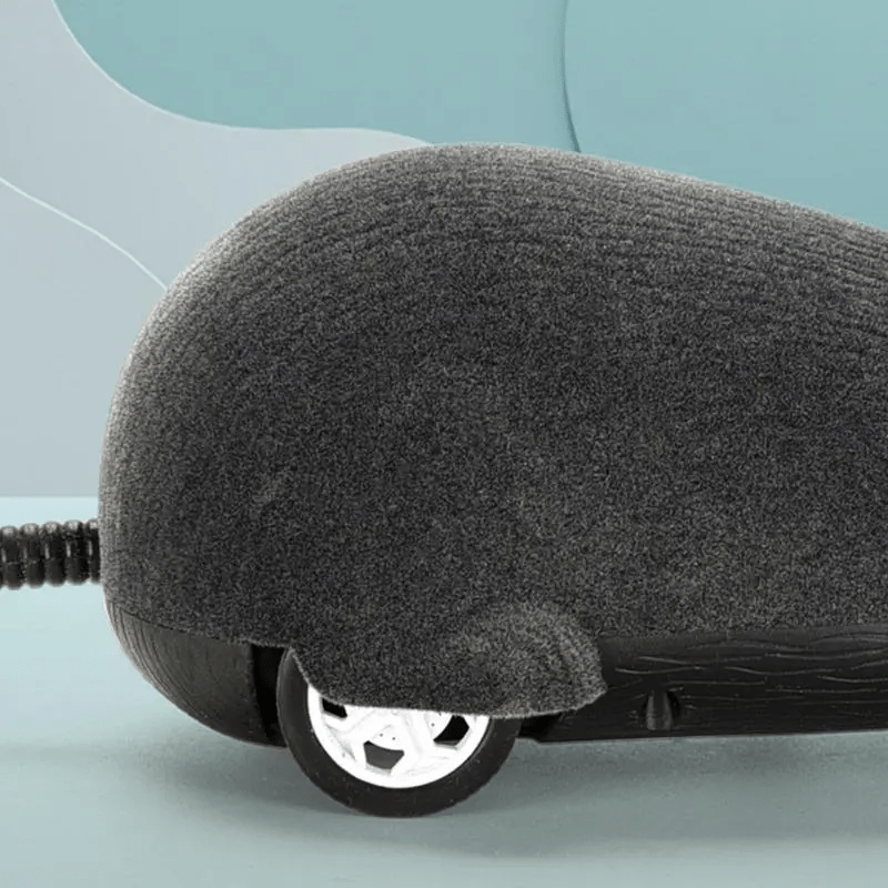 ScamperBot remote-control mouse toy with gray flocked surface and black wheels on turquoise background - interactive pet play