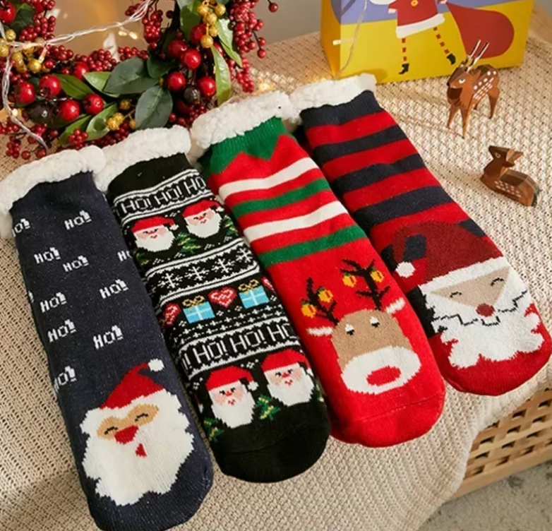 Festive Christmas socks featuring Santa, reindeer, and holiday patterns in black, red, and green with cozy sherpa lining