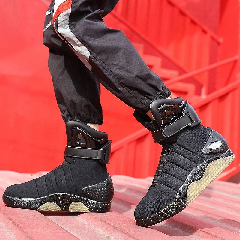 NeoVolt Sneakers in black with padded ankle straps and speckled soles on red urban stairs by HighPeak