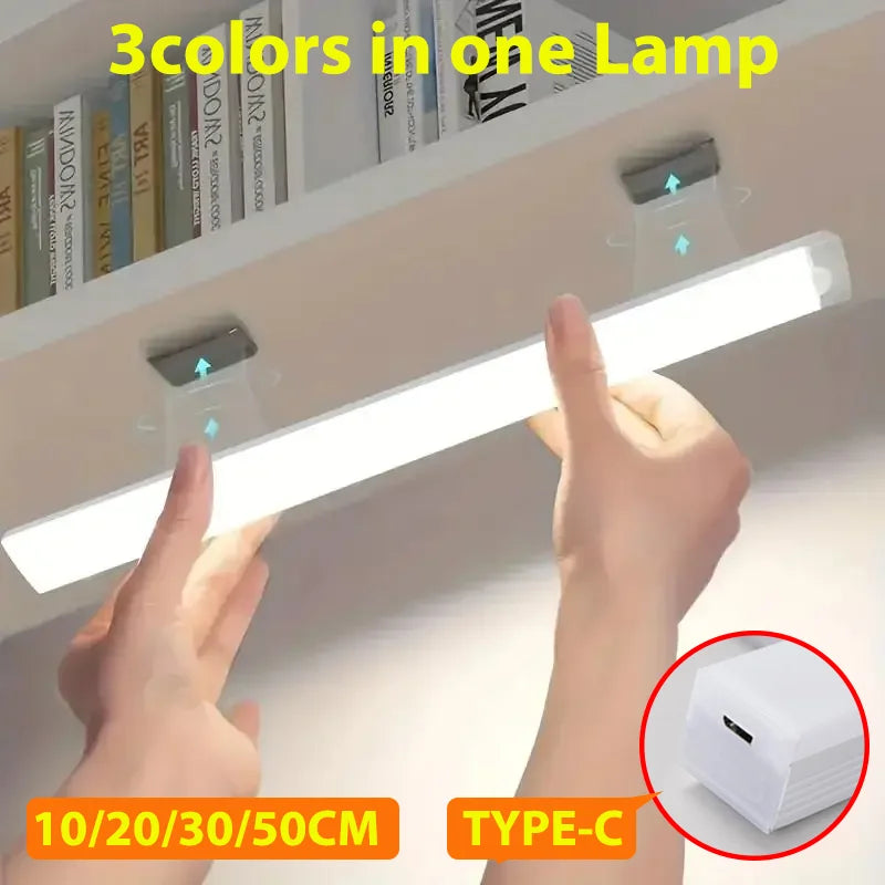 HighPeak Motion Sensor Light being installed under a cabinet with bright white LED strip and Type-C charging port visible