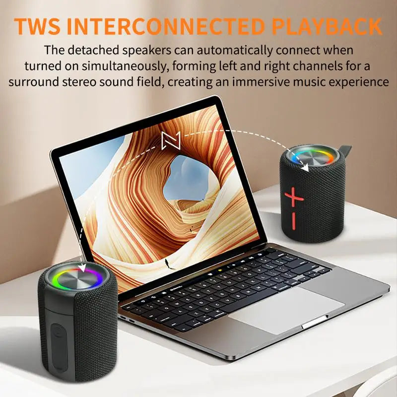 BoomSync - Magnetic 2-in-1 Bluetooth Speaker in black showing dual speaker pairing with laptop on white desk