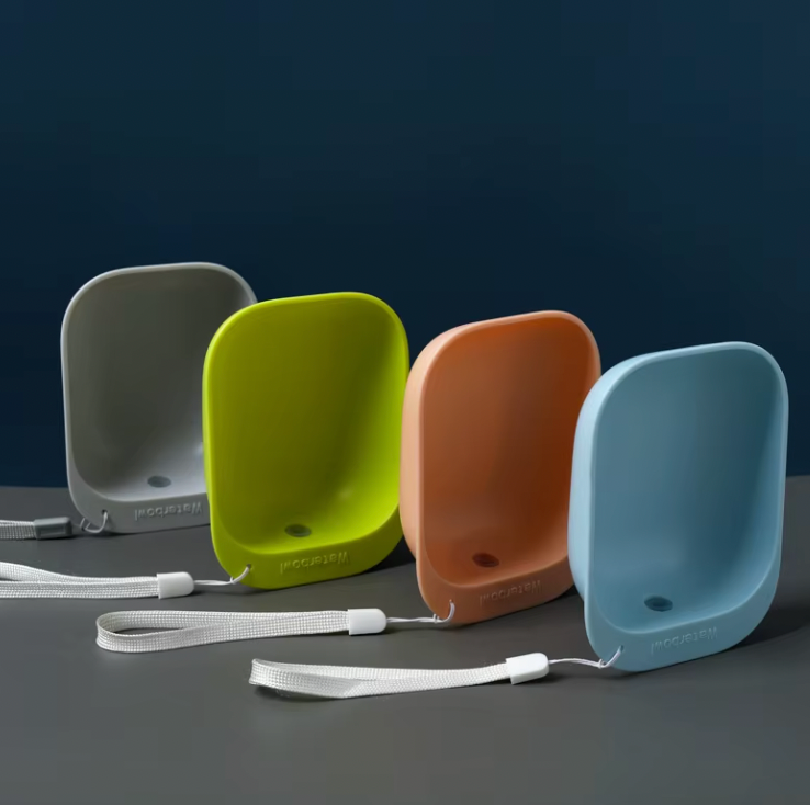 SipPup Cap portable pet water dispensers in gray, green, orange and blue colors with wrist straps on dark background