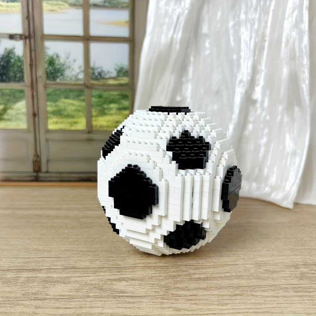 StadiumMaster soccer ball building set in classic black and white blocks displayed on wooden surface near window