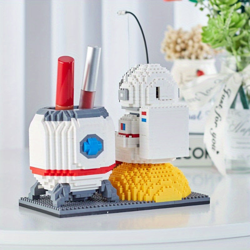 Starlight Voyager brick-built astronaut pen holder with illuminated helmet and lunar base - white and yellow space decor