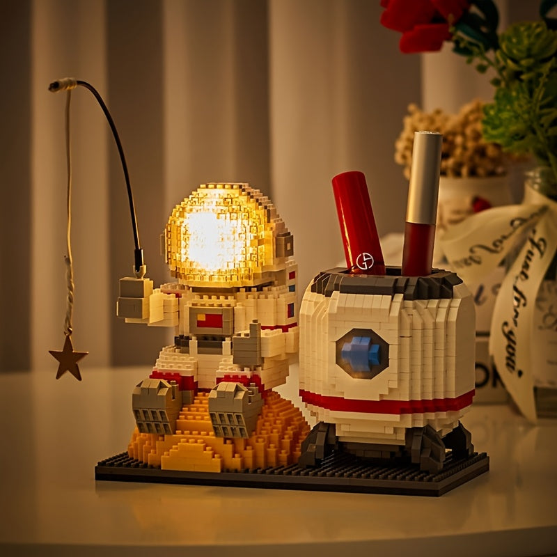 Starlight Voyager illuminated astronaut building set with pen holder, glowing helmet and lunar base display on desk