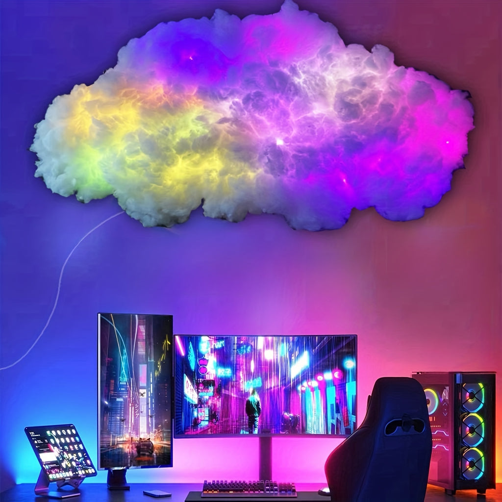 StormFlux LED cloud light in vibrant rainbow colors mounted above gaming setup with dual monitors and neon ambiance