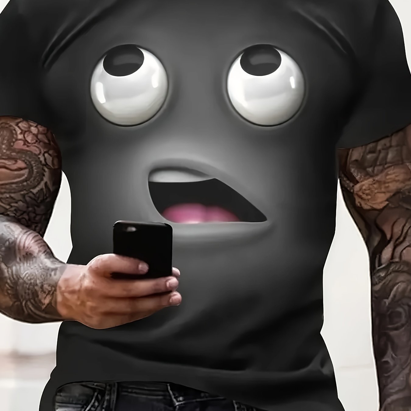 The Bruh Tee featuring 3D black emoji face design with rolling eyes and open mouth, holding smartphone - streetwear statement piece