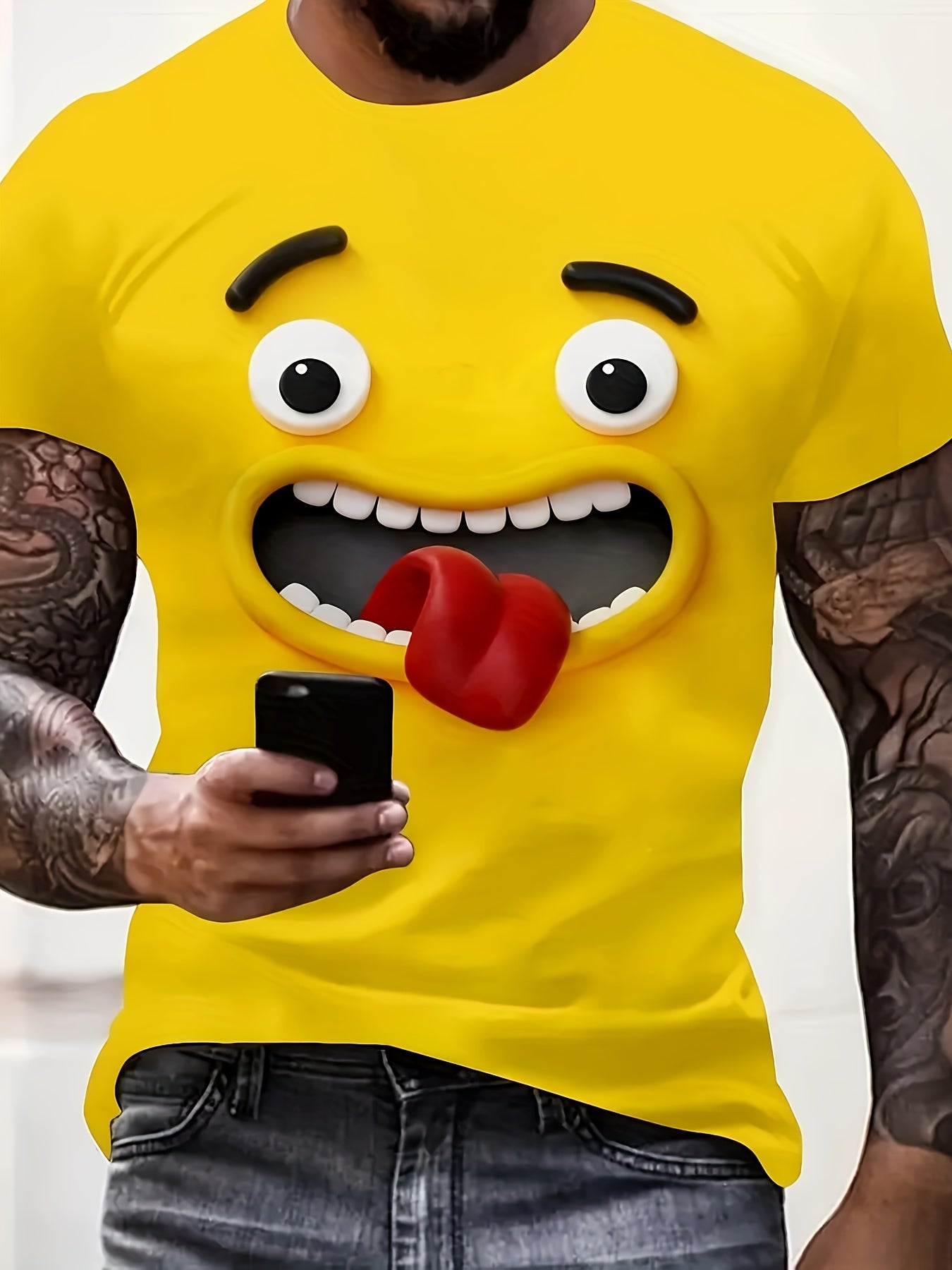 The Bruh Tee featuring 3D emoji face design in bright yellow with expressive eyes and tongue-out expression, shown on casual wear