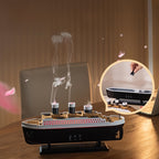 TitanicMist aromatherapy diffuser with steam rising from three smokestacks, shown with inset image of filling reservoir - luxury boat design