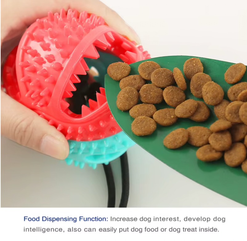 Tug-of-War Toy in coral pink with textured surface shown dispensing brown dog treats onto green surface - interactive pet feeder