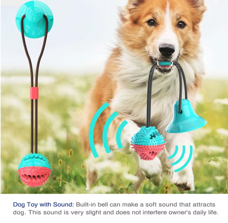 Tug-of-War Toy with turquoise suction cup and pink textured ball being played with in outdoor grass setting