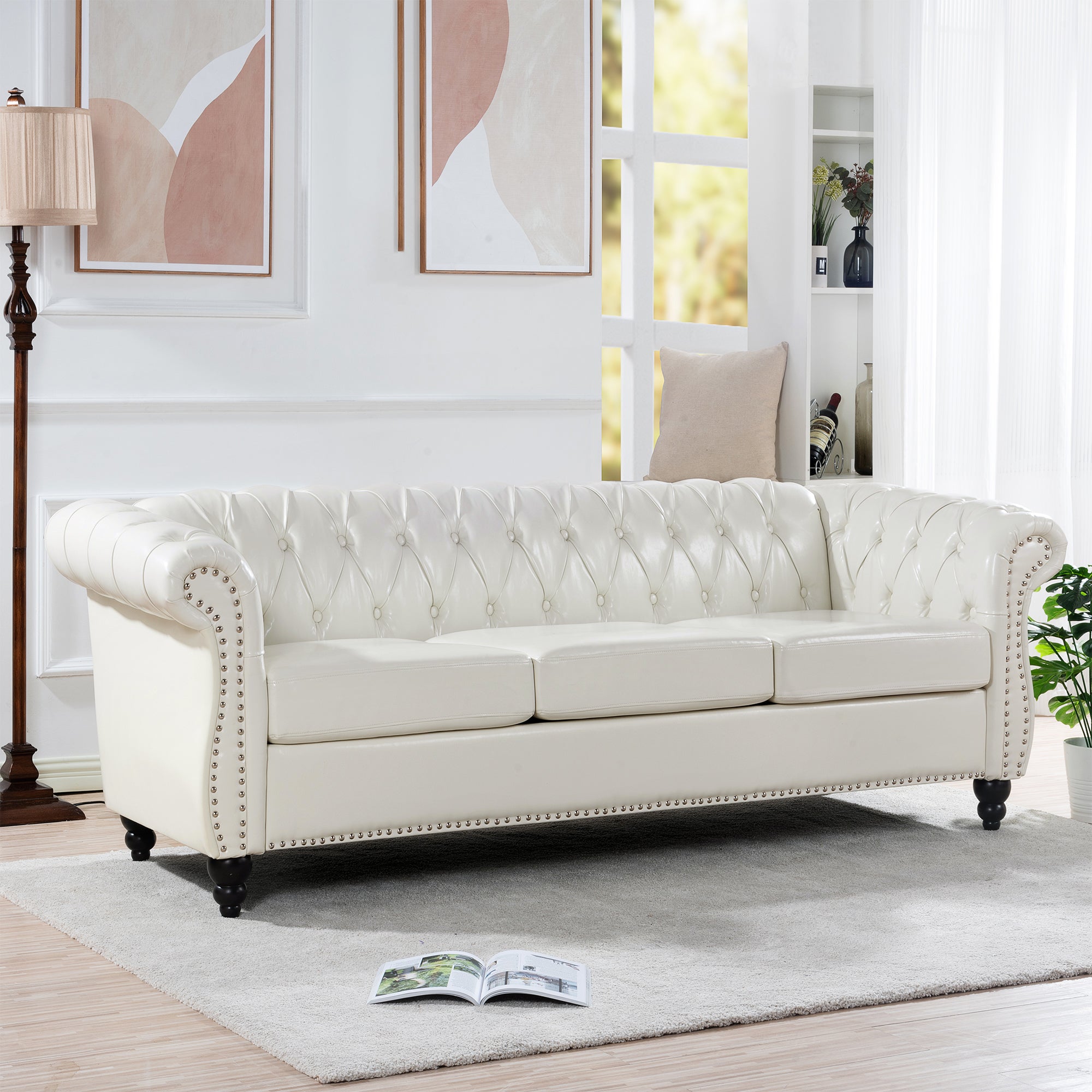 HighPeak Chesterfield Velvet Sofa in cream with tufted back, nailhead trim, turned legs in bright modern living room