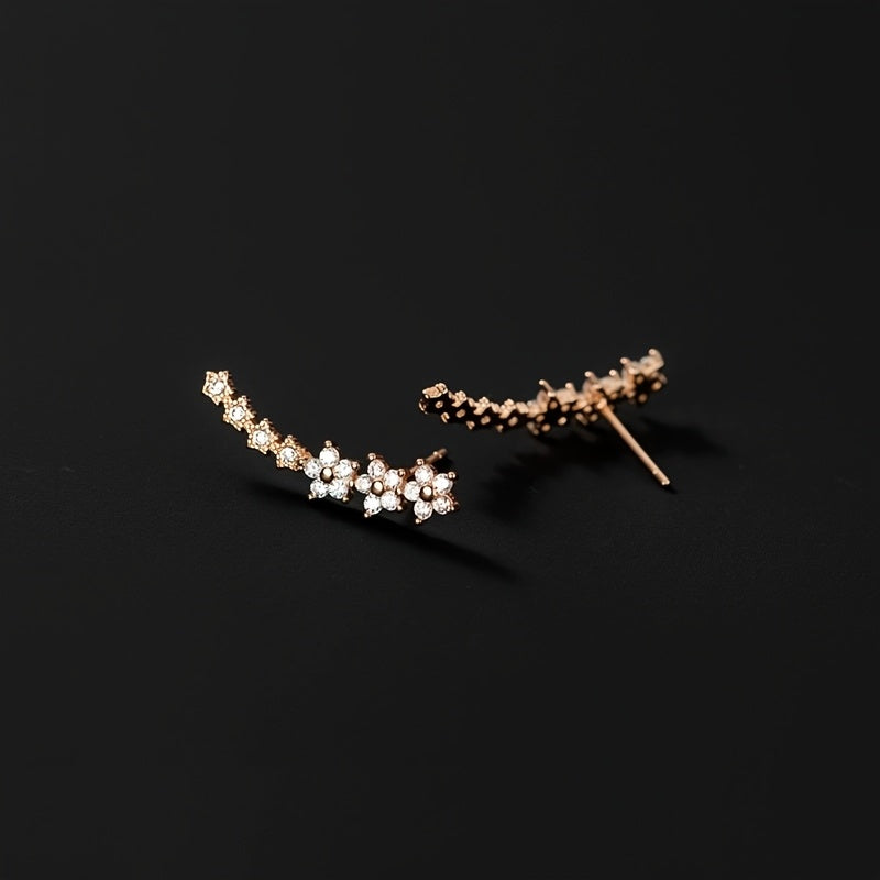 HighPeak Ear Climber Earrings in rose gold with sparkling rhinestones on a black background for elegant everyday wear