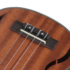 Acoustic Four-String Ukulele bridge close-up with four nylon strings tied over a pale saddle.