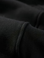 ADHD Frog Meme Hoodie close-up showing the black slight-stretch knit fabric texture