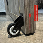 Adjustable Door Support Wheel in Black mounted beneath a cabinet panel with a height adjustment arrow