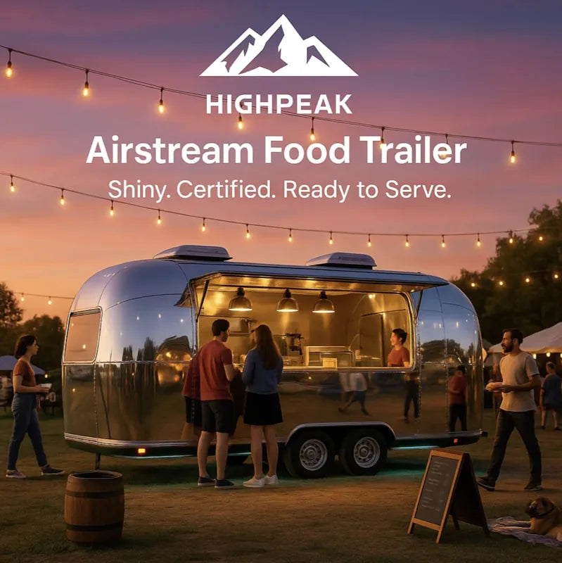 HighPeak Airstream Food Trailer with shiny stainless steel exterior serving customers at an outdoor evening event