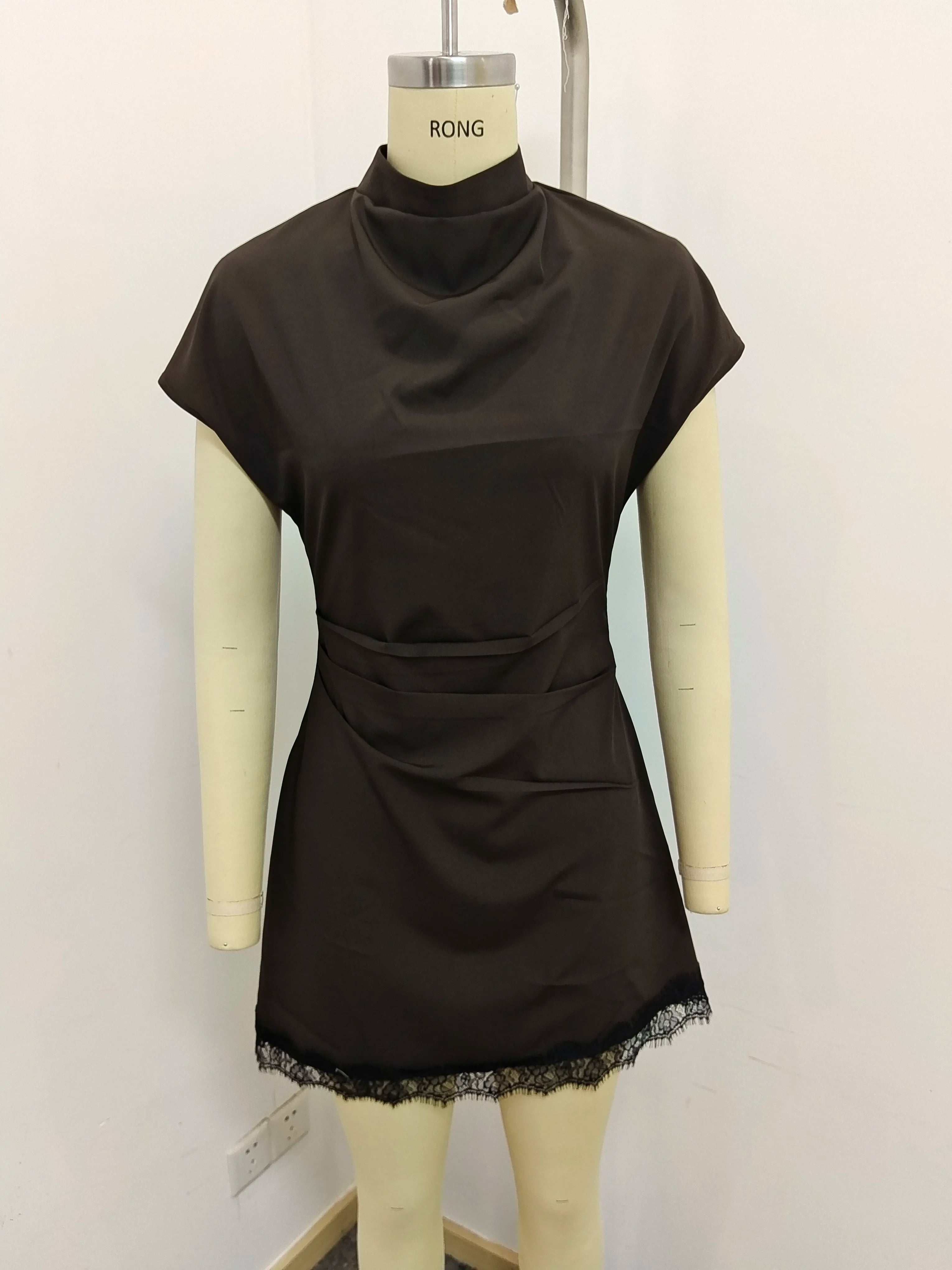 Amorette Lace Mini Dress front mannequin detail showing the ruched waist and draped high neckline