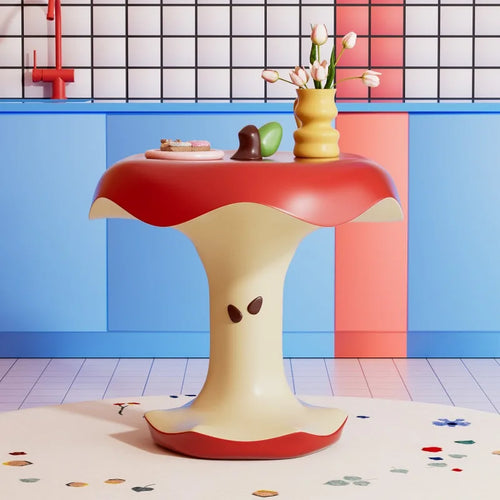 Red and cream Apple Bite Side Table with a vase in a colorful room