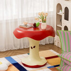 Apple Bite Side Table beside a striped chair and a bright window