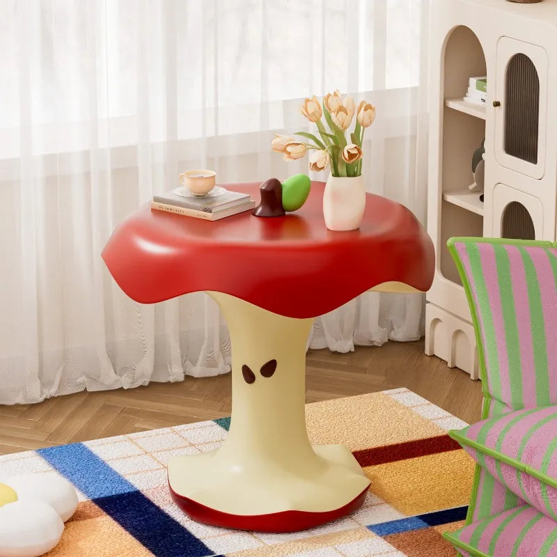 Apple Bite Side Table beside a striped chair and a bright window