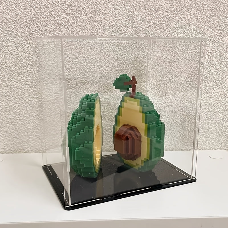 Avocado Building Block Set with both completed halves shown inside a clear display case on a white shelf