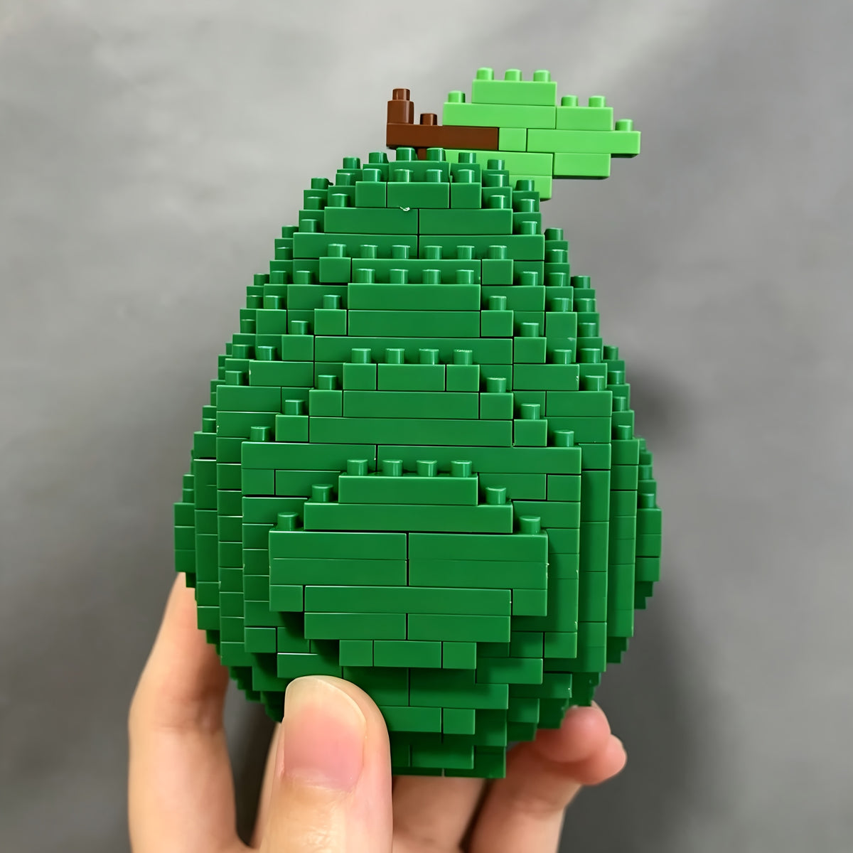 Avocado Building Block Set showing the green brick exterior and leaf detail from the back