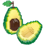 Avocado Building Block Set with one half upright and the other angled beside it on a white background