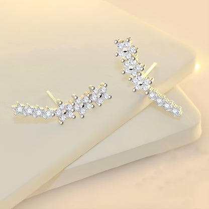 HighPeak Ear Climber Earrings in gold with sparkling rhinestones on a soft beige display for elegant style
