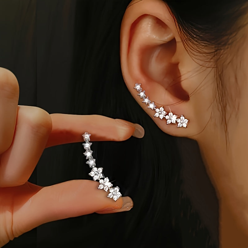 HighPeak Ear Climber Earrings in sparkling rhinestones shown worn and held, featuring curved design along ear.